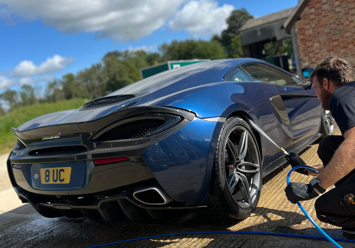 A team member at cotswold valet working on a car